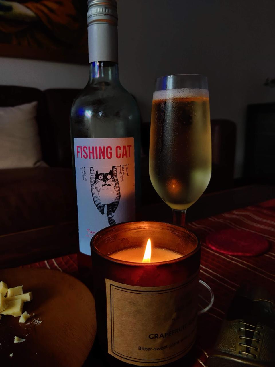 Candlelit dinner table set with wine glasses
